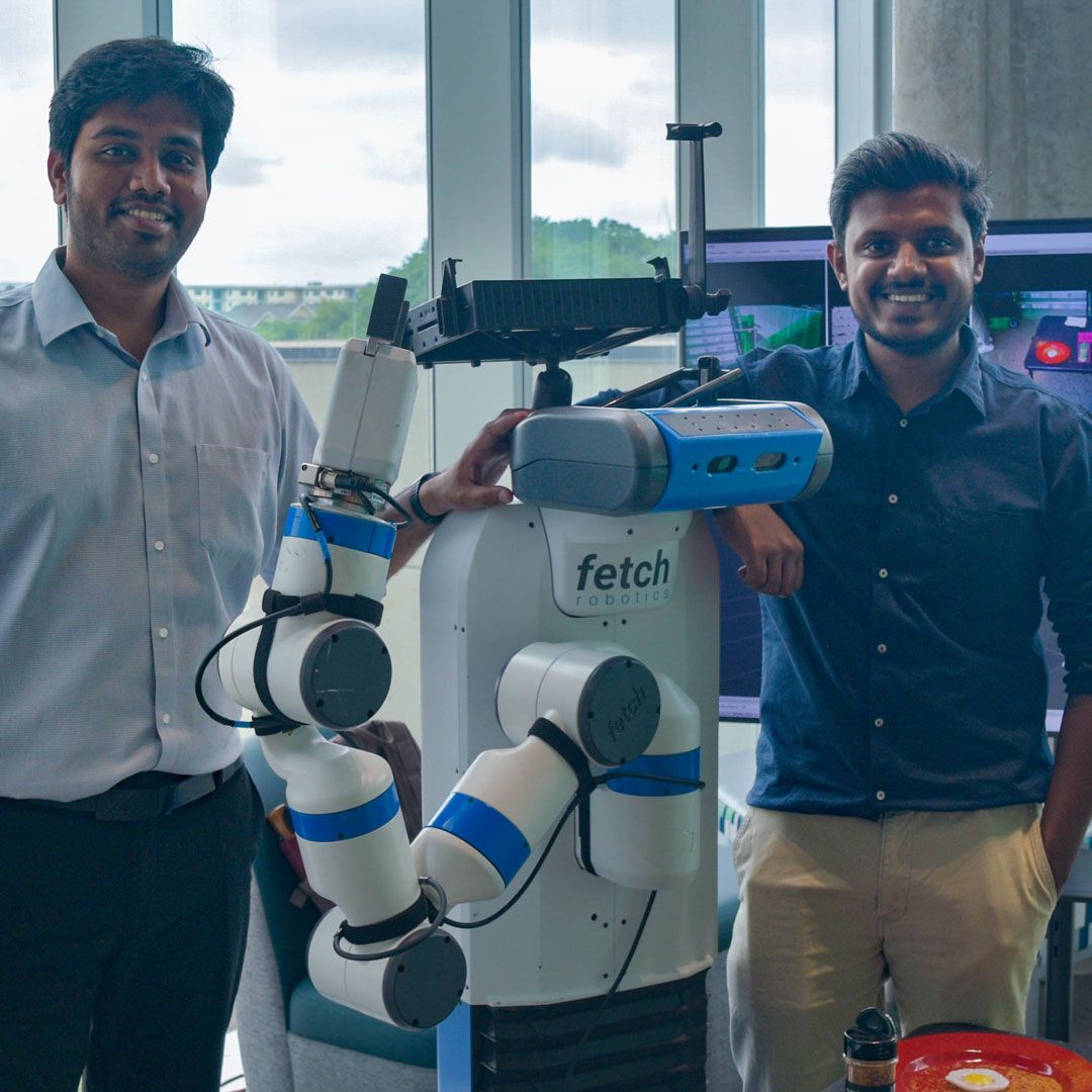 UT Dallas Jonsson School ECS AI Days 2026 event recap — at the HRT1 demo (Fetch robot setup, IRVL)